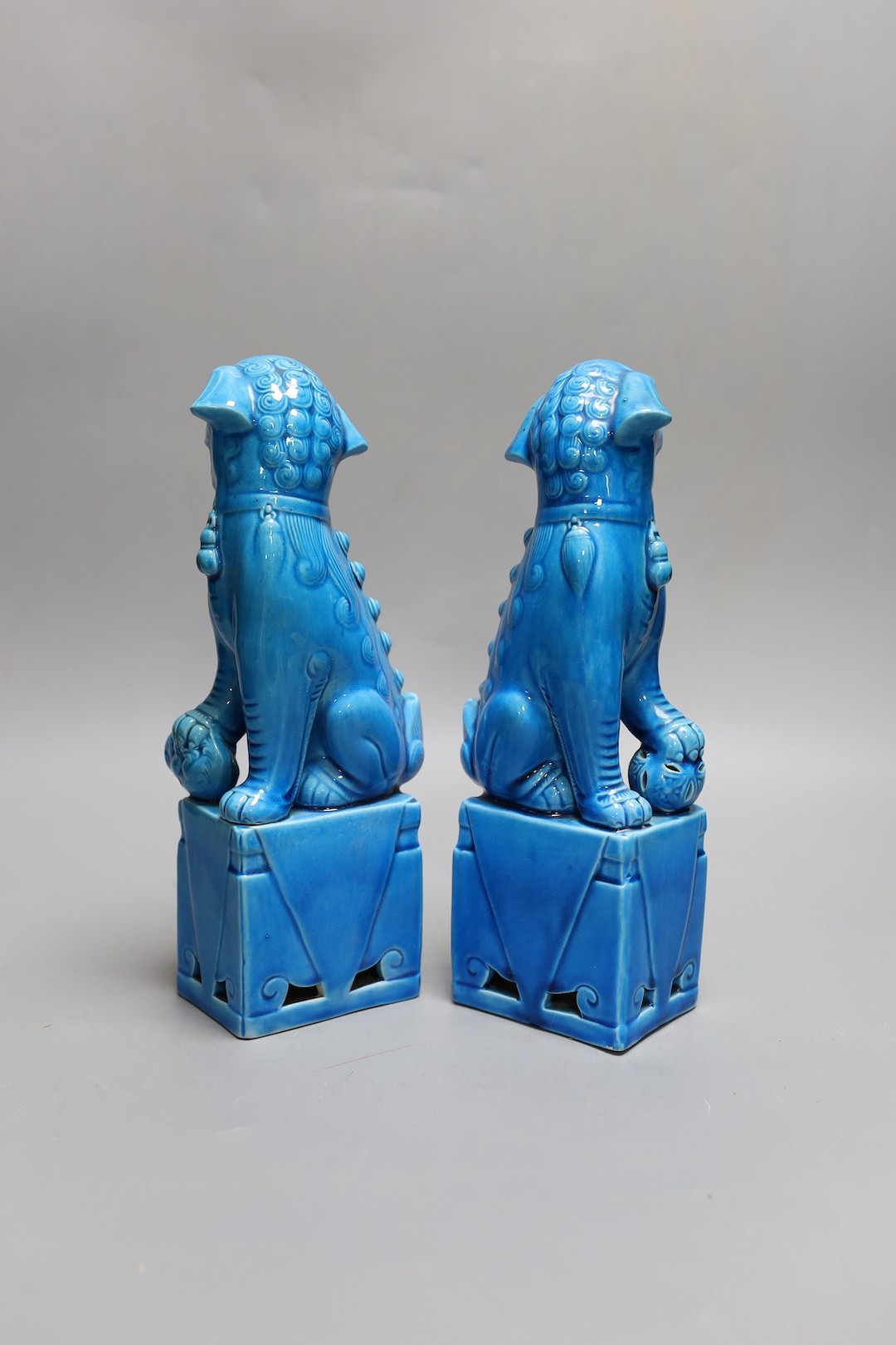 A pair of Chinese turquoise glazed lion dogs, 26.5cm, two Chinese dishes other Oriental ceramics etc.